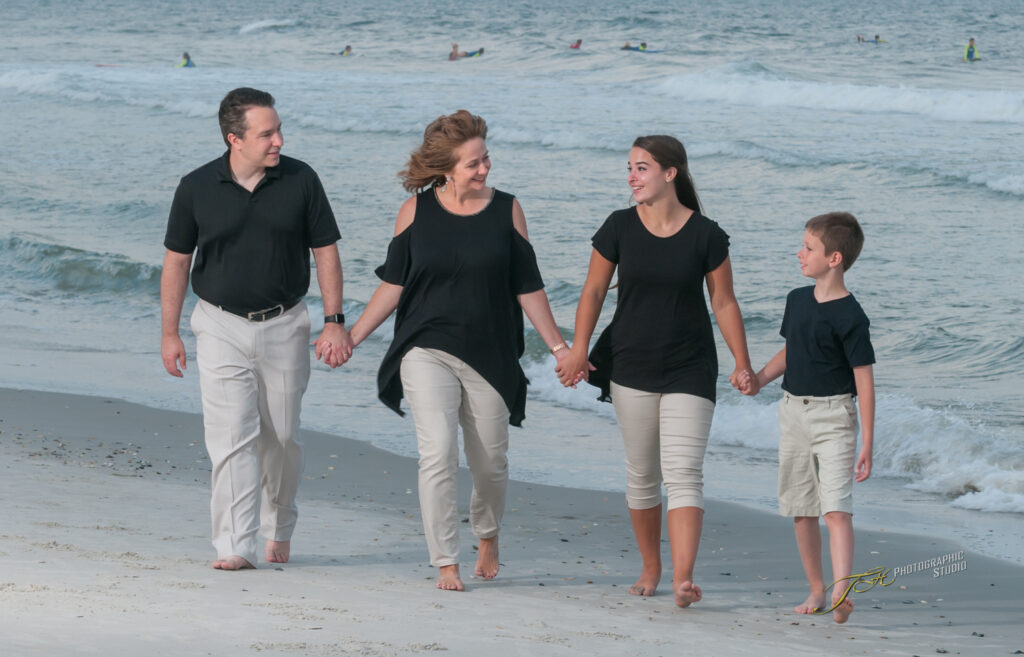 Fun Photo Idea Of a Family Walking and Engaged With Each Other On Topsail Island Beach