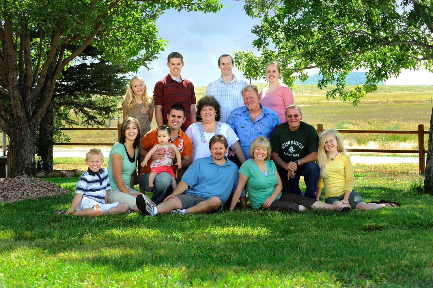 Picture of a Family at a Park Dressed in Miss Matched Clothing